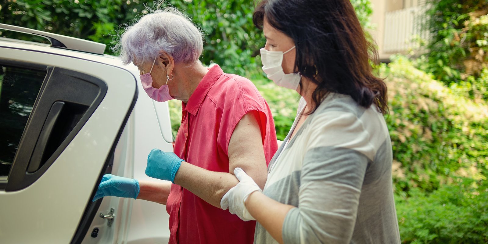 Caregiver Traveling Back And Forth From The Hospital And An Elde